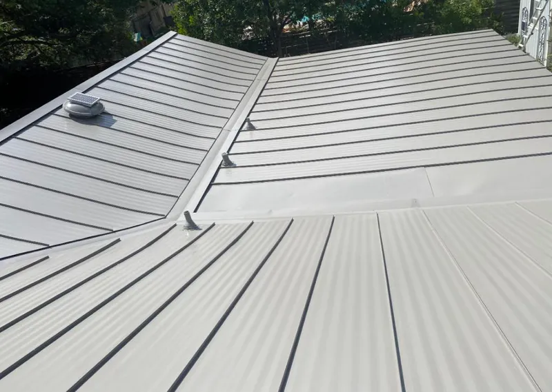Solar attic fan installed on a metal roof for Roof Ventilation in Cresaptown